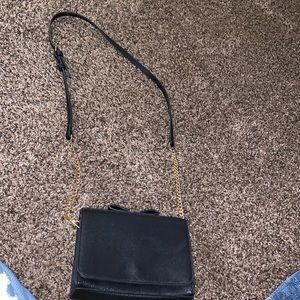 Black cross body purse lightly used missing one zipper still works